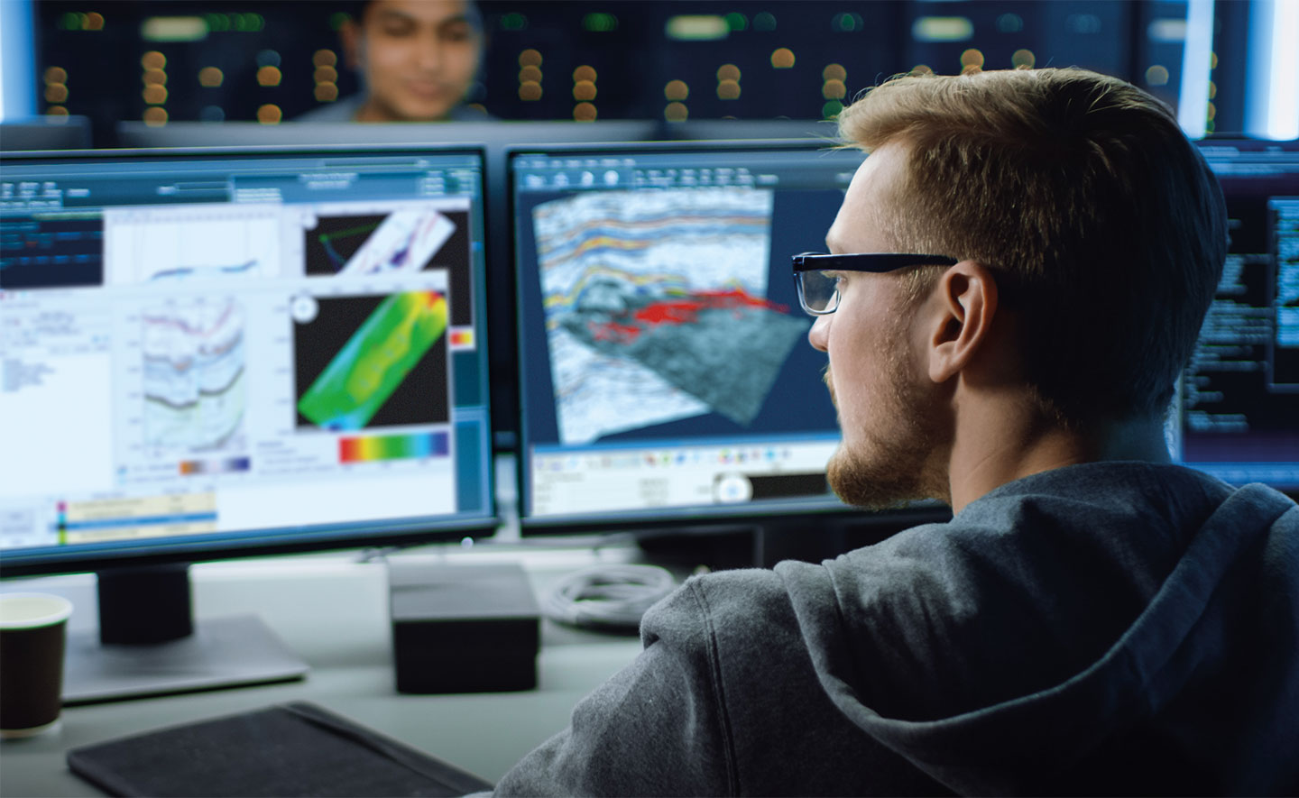 Geoscientists reviewing seismic interpretation and data visualizations – Sharp Reflections